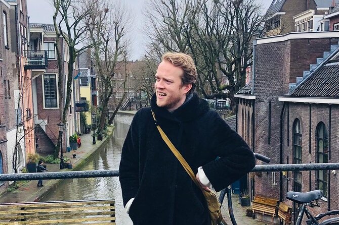 Utrecht Walking Tour with a local comedian as guide - Exploring Oudegracht and Its Famous Wharf Cellars