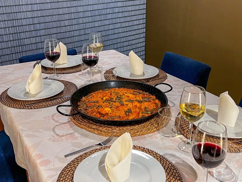 Valencia: Paella Cooking Class with Central Market Tour - Enjoying Paella with Local Tapas and Wines