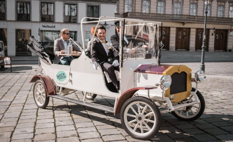 Vienna: City Sightseeing Tour in an Electro Vintage Car - Indulge with Austrian Sparkling Wine and Local Snacks