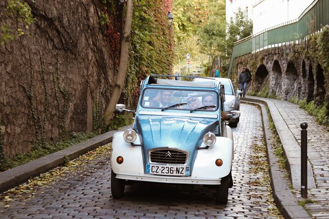 Vintage 2CV Adventure: 1 Hour 30 min Paris Secrets Tour - Admiring the Elegance of Place des Vosges