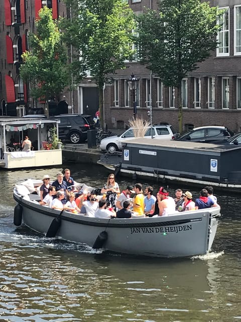 Visit Amsterdam by Boat with a French Guide (french) - Key Points