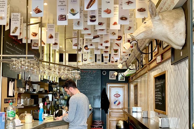 Walk & Wine Tour in the Latin Quarter - Sipping Wine at the Hidden Bar on Boulevard Saint-Germain
