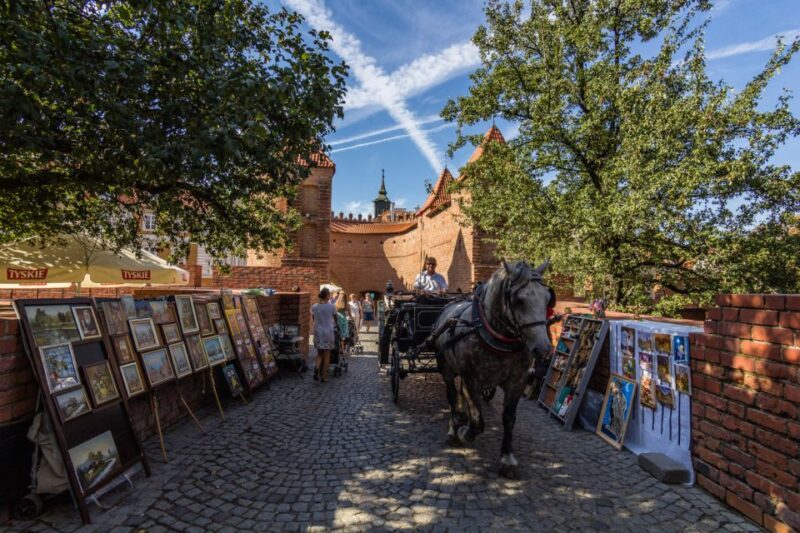 Warsaw: Private Walking Tour with Professional Guide - Visiting the Warsaw Barbican and Historic City Walls