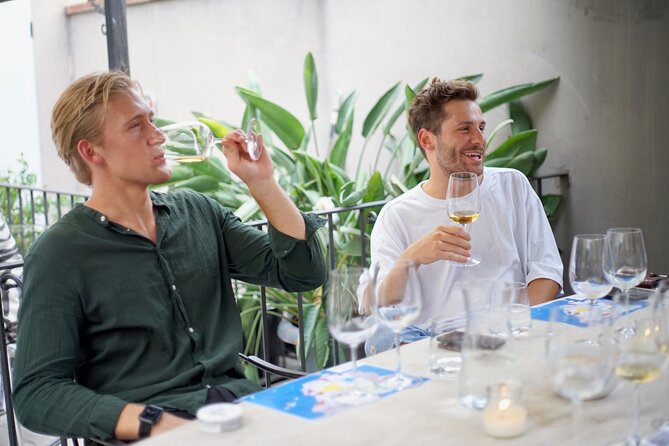 Wine Tasting Experience with a Professional Sommelier in Valencia City Center - Complementary Spanish Tapas and Petit Fours