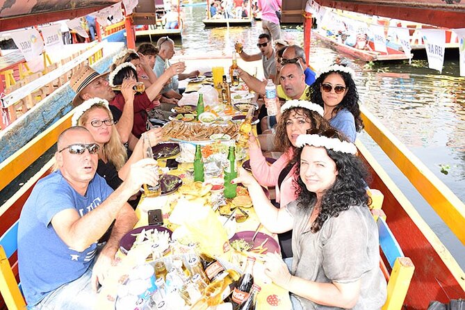 Xochimilco floating gardens, Coyoacan and UNAM murals - Additional Stops: Azteca Stadium and Local Markets