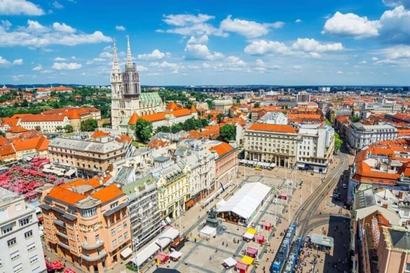 Zagreb : Must-See Attractions Walking Tour With A Guide - Visiting the Zagreb Cathedral and Bustling Dolac Market
