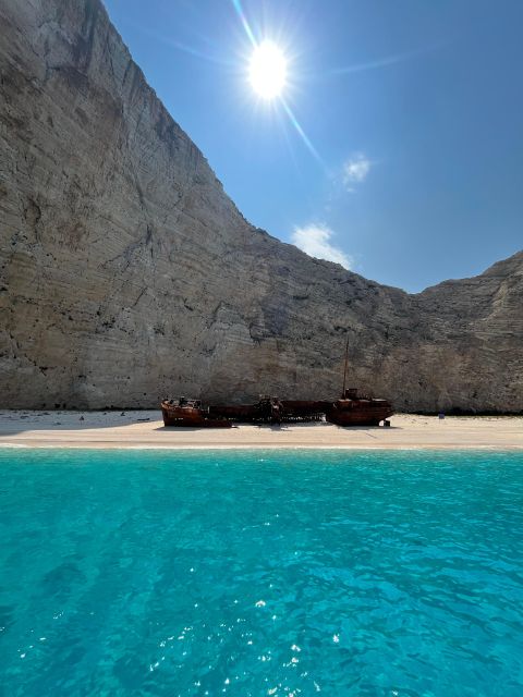Zakynthos: Glass-Bottom Boat to Navagio, Caves & White Beach - Relaxing at the White Beach and Its Scenic Charm