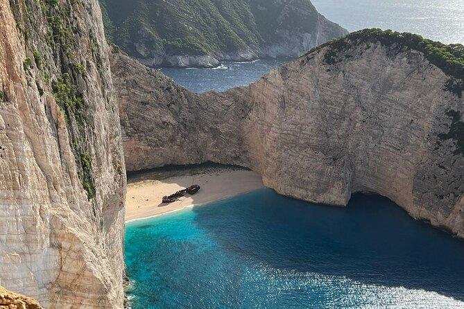 Zakynthos Top Sights Morning Tour Shipwreck and Blue Caves - Diving into the Blue Caves Mesmerizing Colors