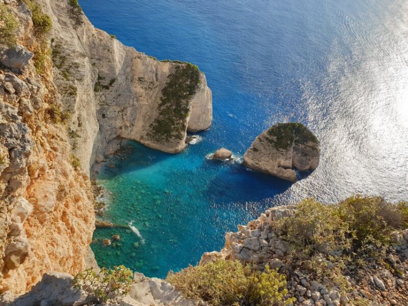 Zakynthos: West Coast & Navagio Bay Cruise with 2 Swim Stops - Zakynthos West Coast Scenic Views and Cave Exploration